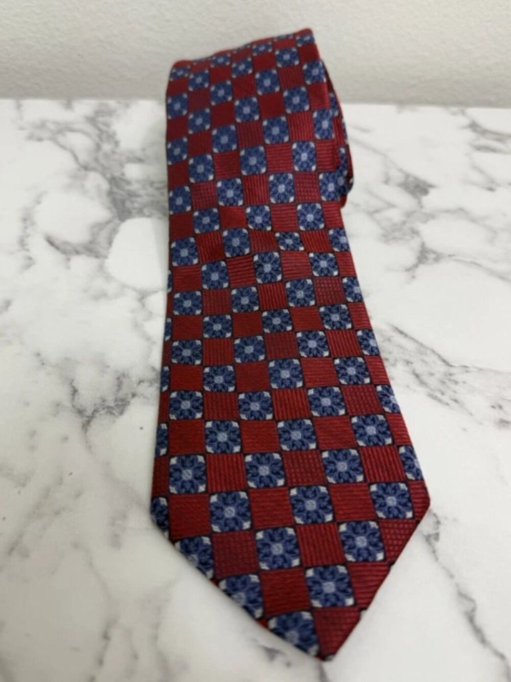 Silk Tie With A Blue And Red Checkered Floral Design